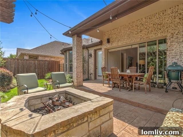 Private fenced patio featuring a pergola, perfect for outdoor entertaining and relaxation.