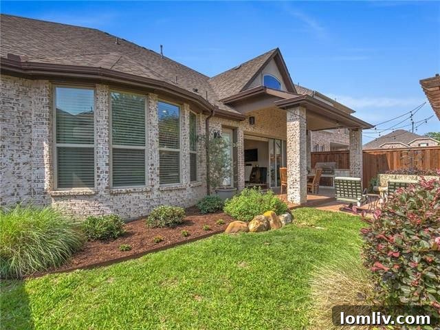Inviting outdoor patio space showcasing thoughtful landscaping and ample room for seating.
