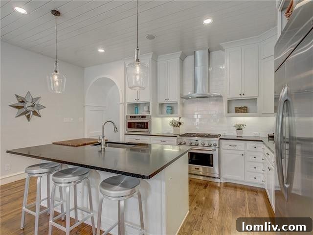 Spacious dining area with elegant chandelier and large windows overlooking lush greenery.