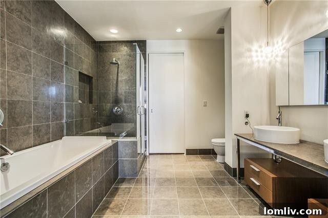 Luxury master bathroom with soaking tub and frameless glass shower