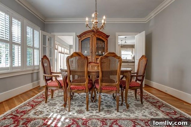 Priced Right and Ready on Windsor Place 6 Spacious living room with elegant fireplace and ample natural light