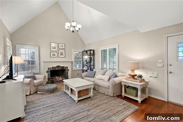 Spacious Living Room with Vaulted Ceiling and Stone Fireplace