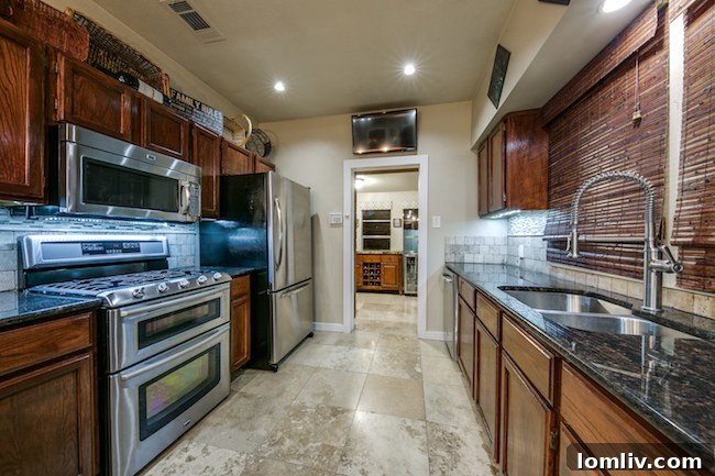 Contemporary kitchen design featuring a gas range and stylish lighting