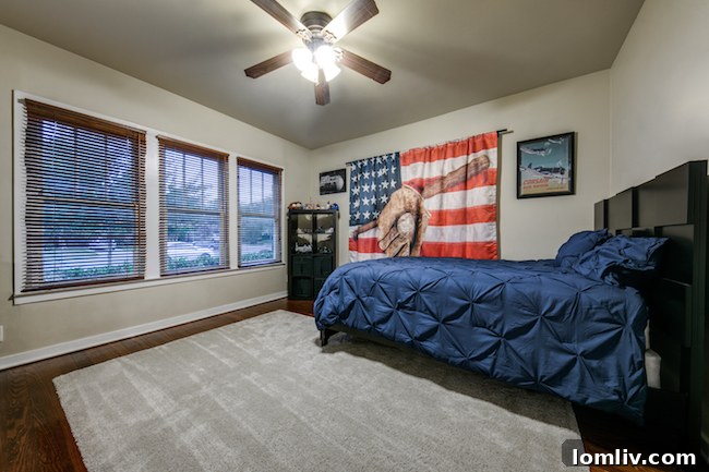 Secondary bedroom with ample natural light and original flooring