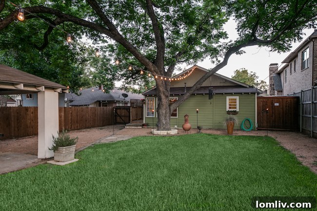 Spacious backyard with mature trees at 5939 Richmond Ave Dallas