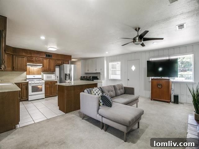 Large kitchen area with views of the sprawling backyard, offering a fantastic renovation opportunity