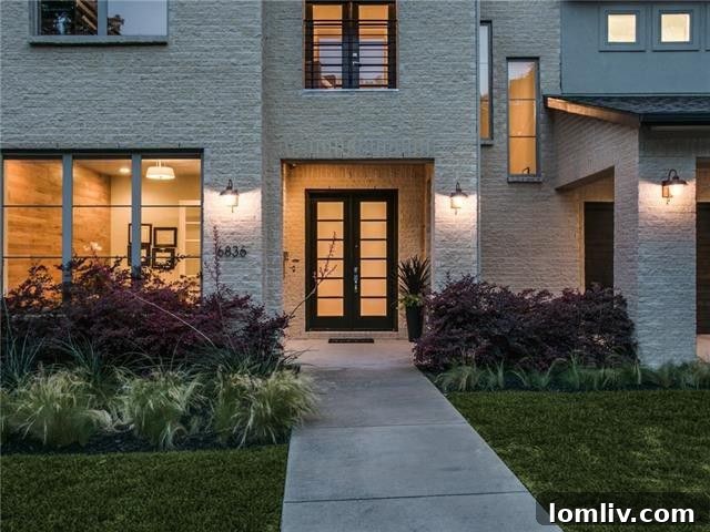 Elegant living room with a contemporary fireplace and abundant natural light at 6836 Casa Loma Ave