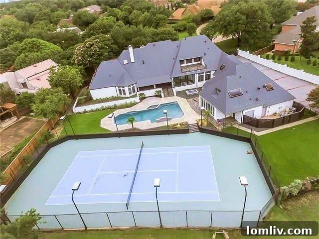 Private tennis court and expansive backyard with pool