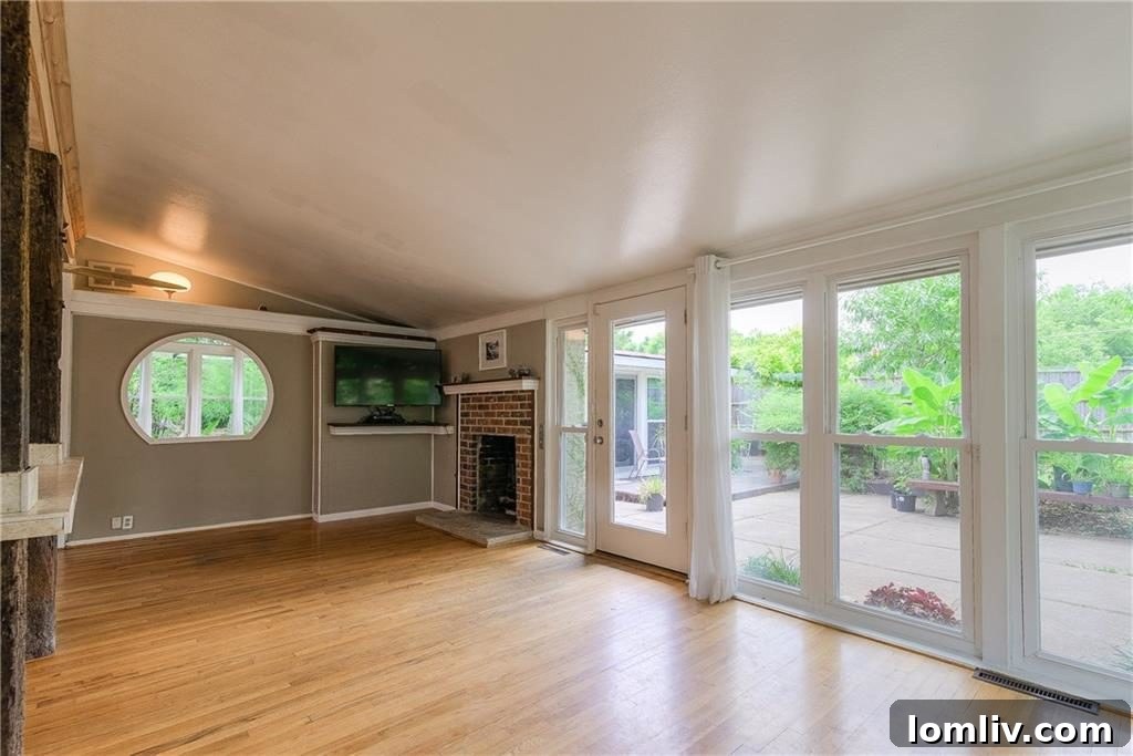 Modern kitchen with wooden cabinetry in Cliff May home