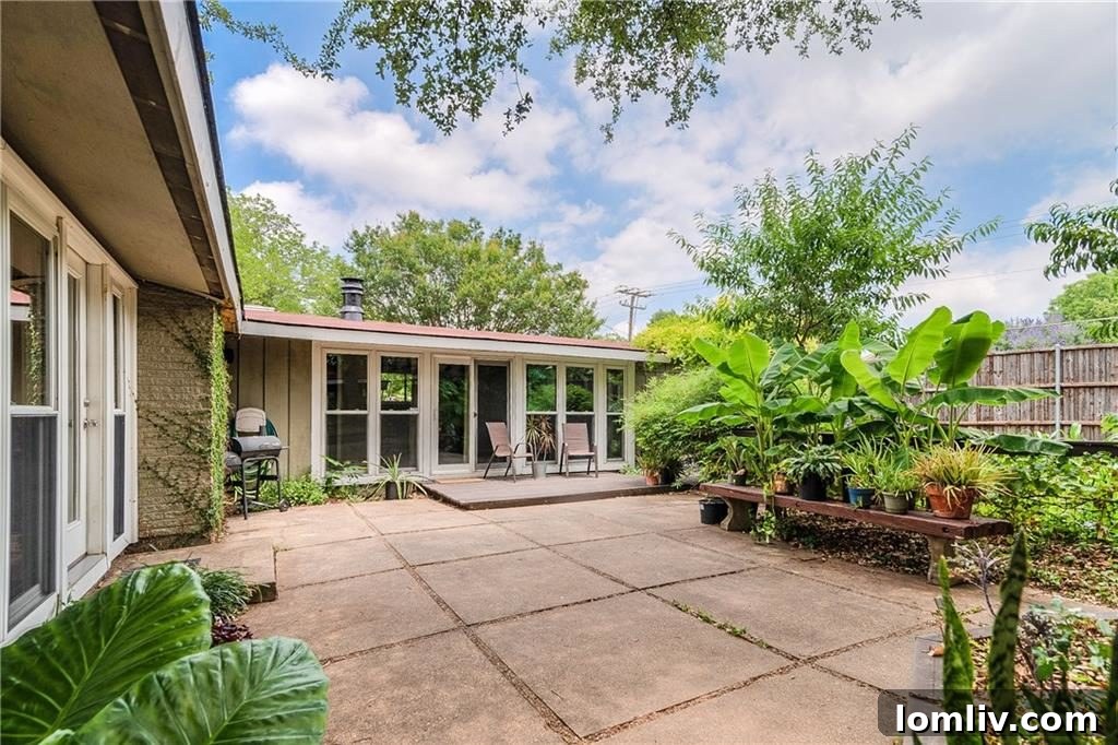 Lush backyard oasis with mature trees and garden