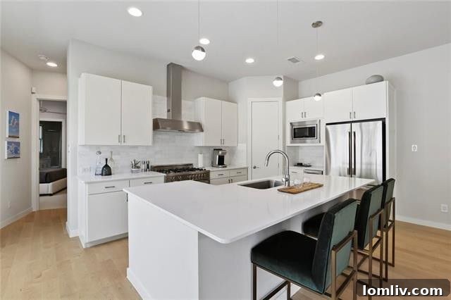 Modern kitchen with white cabinets and quartz countertops
