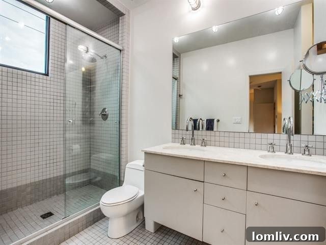 Luxurious master bathroom with a full-sized shower and double vanity.