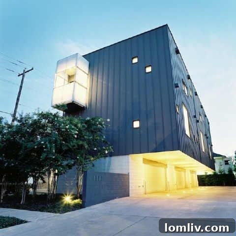 Exterior view of 4001 Bowser Ave. townhomes, showcasing modern architecture by Russell Buchanan that impresses day and night.