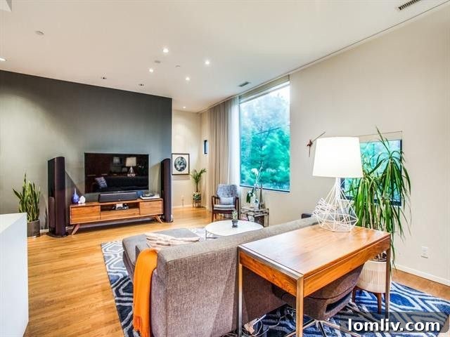 Sleek kitchen design featuring stainless steel appliances and open shelving.
