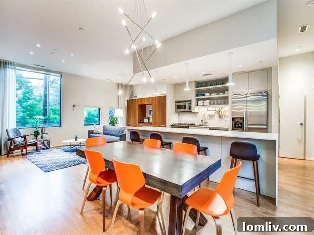 Well-lit kitchen space with contemporary lighting fixtures and ample counter seating.