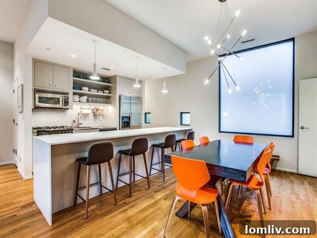 Overview of the open kitchen, dining, and living area on the second floor.