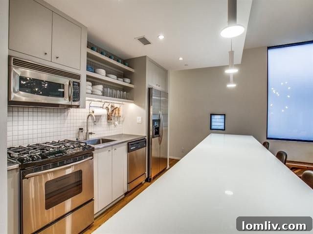 Dining area seamlessly connected to the remodeled kitchen and living space.