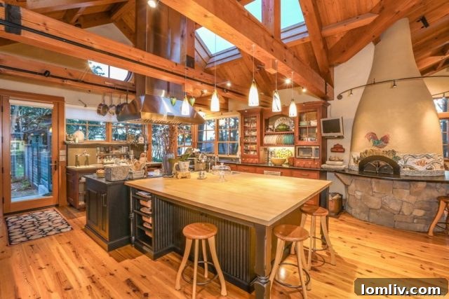 The exterior of the Madroneagle Estate's barn, featuring rustic architecture and surrounded by trees.