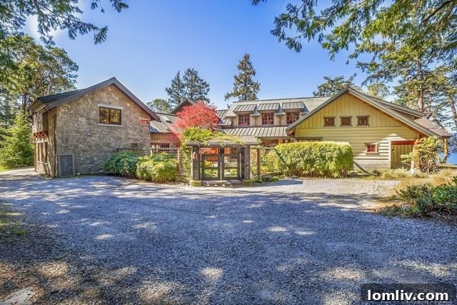 Interior view of a spacious bedroom with a fireplace and large windows overlooking the natural landscape at Madroneagle Estate.