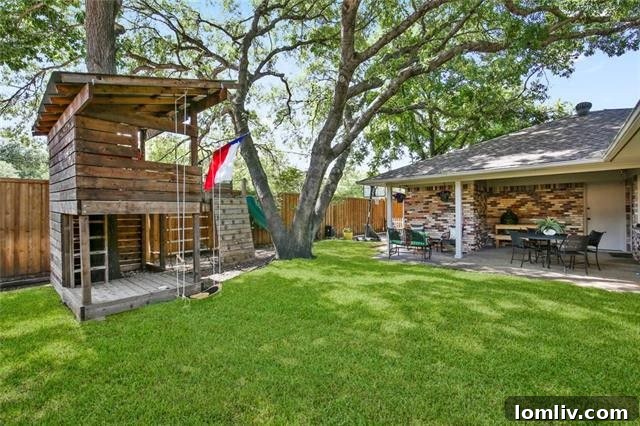 Covered Outdoor Living Space in the Lake Highlands Home's Backyard