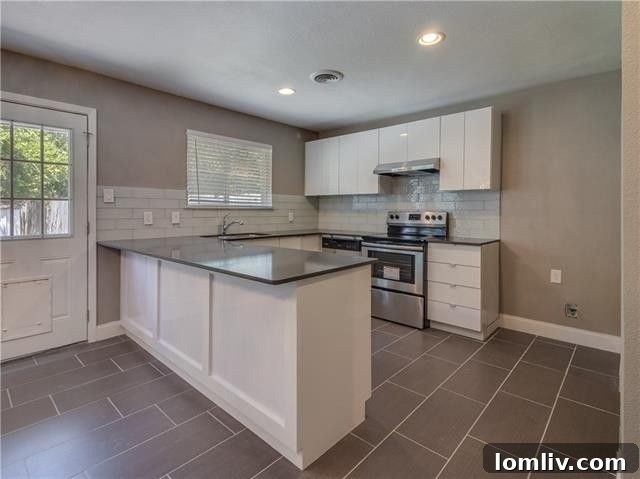 Spacious bedroom with clean laminate flooring and fresh paint