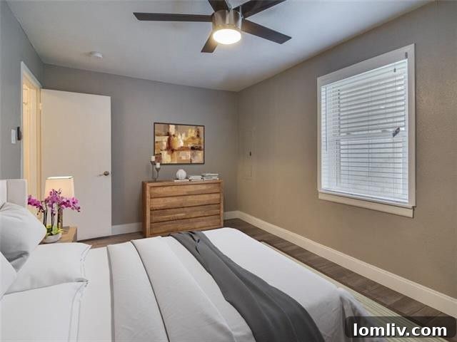 Another view of a bedroom, highlighting natural light and modern finishes