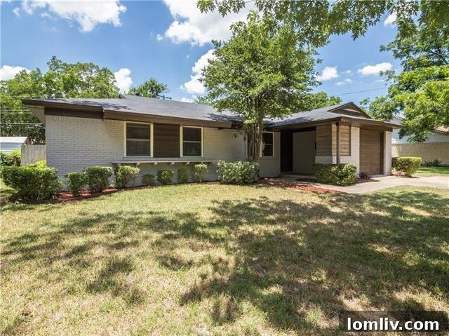 Exterior view of 12227 Brisbane Ave with fresh paint and manicured landscaping