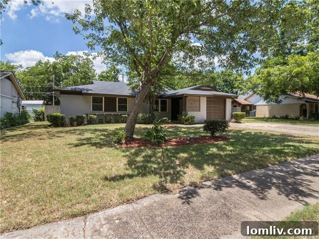 Front entrance and inviting porch of the renovated Farmers Branch home