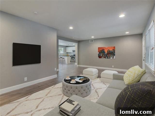 Bright and airy living room with laminate flooring and recessed lighting
