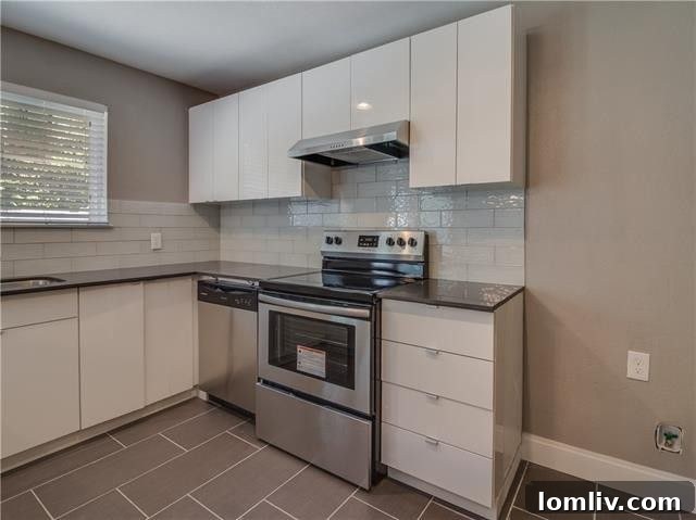 View of the open floor plan connecting living, dining, and kitchen areas