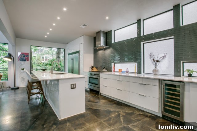 Open concept living area showcasing the tall wall of windows and connection to the modern kitchen