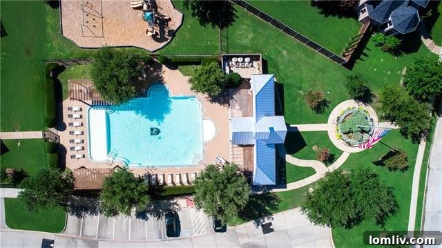 Serene view of the Frisco neighborhood with mature trees and well-maintained homes