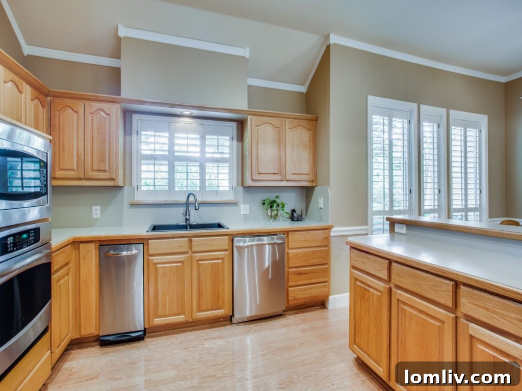 Spacious living room with a modern fireplace and gleaming hardwood floors at 824 Timber Ridge Drive