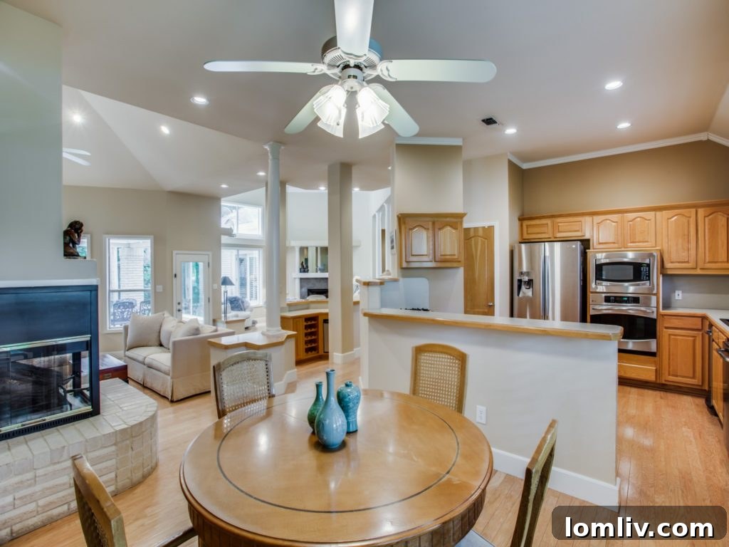 Elegant dining area seamlessly adjacent to the living space, offering an open flow at 824 Timber Ridge Drive