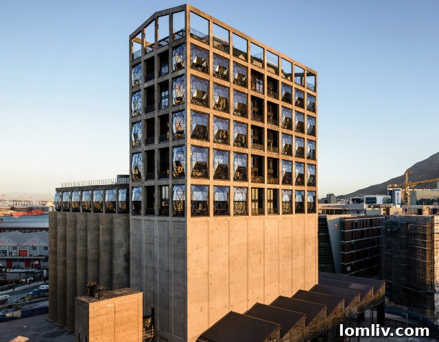 The transformed Silo building at V&A Waterfront, showcasing the distinctive bulging windows of The Silo Hotel against the industrial museum structure.