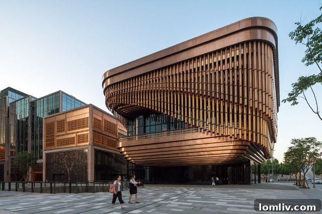 The Bund Financial Center in Shanghai by Heatherwick and Foster + Partners, showing the multi-layered, moving curtain facade in its open position.