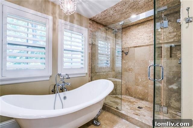 Spa-like master bathroom with clawfoot tub and oversized shower