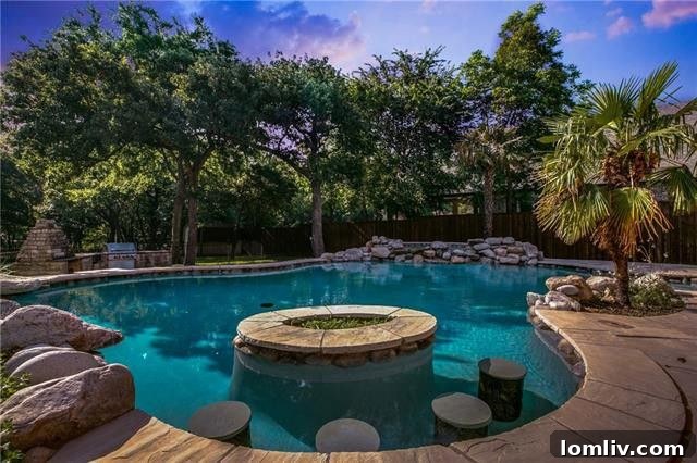 Resort-style backyard with swimming pool, swim-up bar, and stone patio