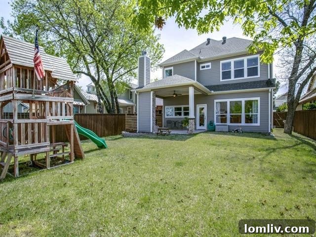 Spacious backyard with covered patio and outdoor fireplace