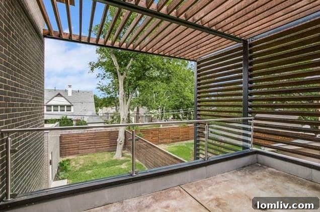 Another view of a spacious bedroom with large windows