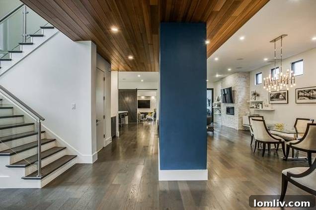 Inviting foyer with a warm wooden drop ceiling in a modern home