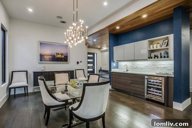 Spacious formal dining room with a wet bar and wine refrigerator, ideal for entertaining