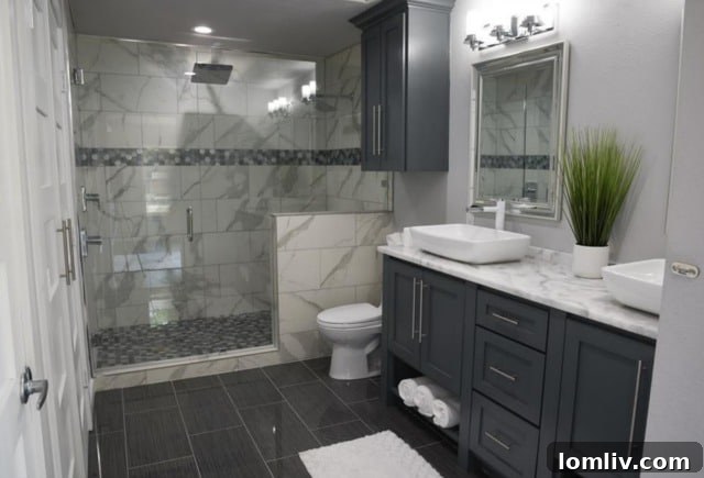 Luxurious master bathroom featuring a large walk-in shower with dual heads and designer tile