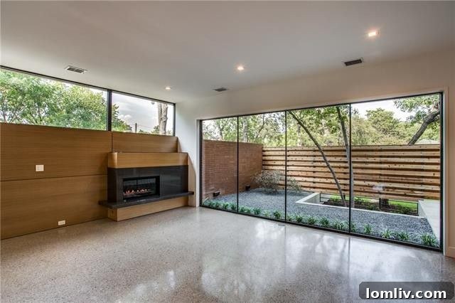 Contemporary open-plan kitchen with warm wood cabinets and quartz countertops