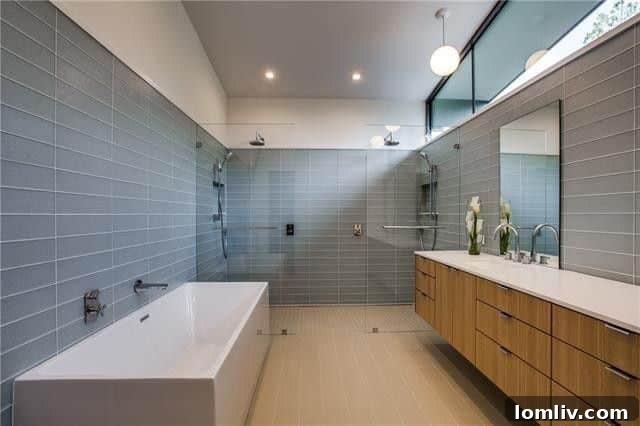 Spacious bedroom with natural white oak hardwood floors and a private balcony