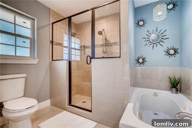 Lush backyard featuring a privacy fence and mature shade trees