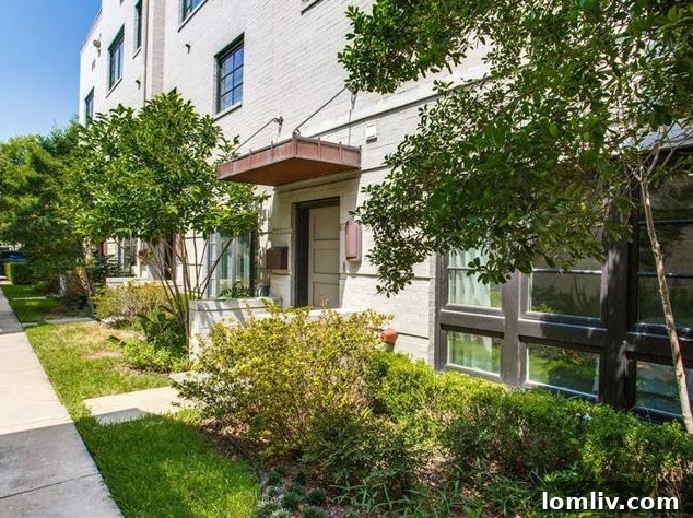 Arch Adams Townhouse: Modern Elegance, Prime Address 2 Exterior view of 716 Arch Adams Lane townhouse with modern industrial design