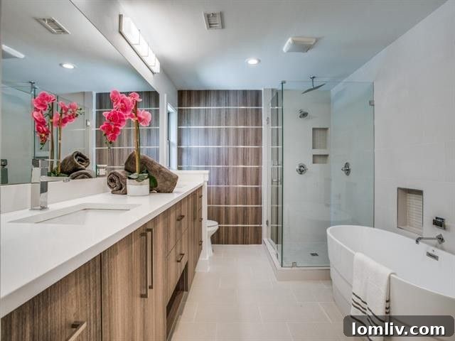 Luxurious master bathroom with designer tiles and a frameless glass shower.