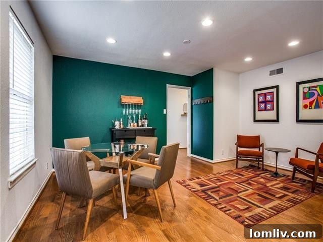 Spacious bedroom with hardwood floors and ample natural light