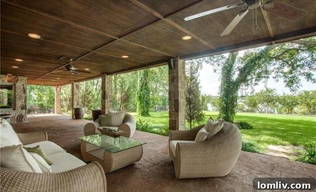 Stunning lakeside residence at 8326 Garland Road, Forest Hills, offering luxurious living.